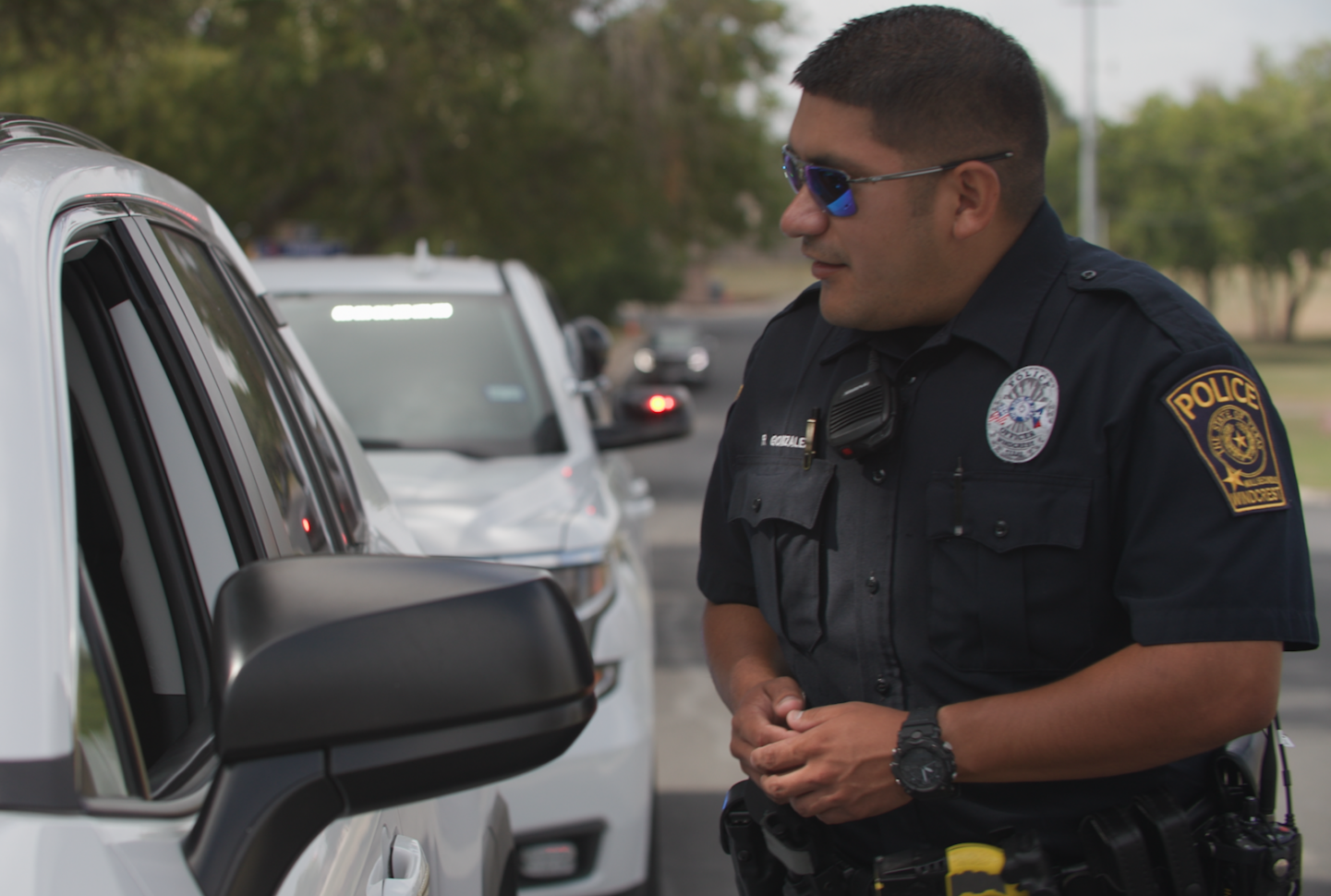 Officer speaks to driver during traffic stop